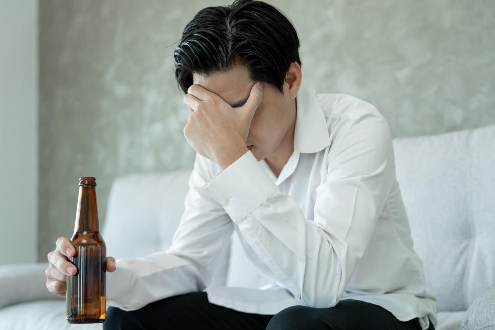 The Struggle of Addiction - Adult IOP Support in California Man grappling with addiction as a concept for Adult IOP in California